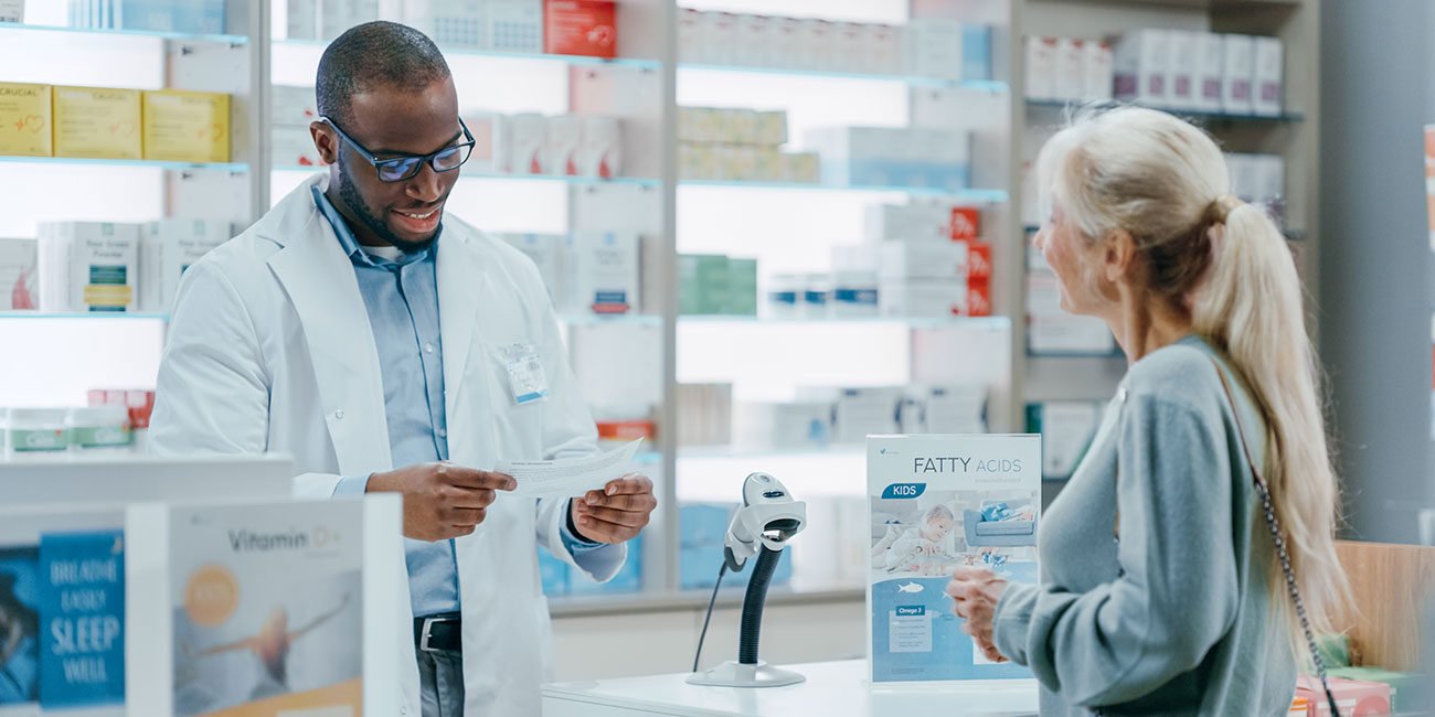 A patient speaking with a pharmacist