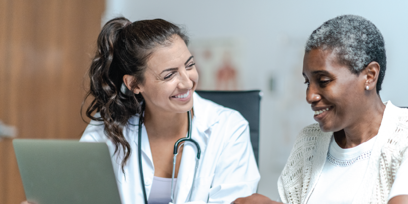 A medical provider and patients smiling